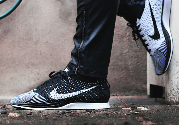 Nike flyknit racer black white volt on top feet